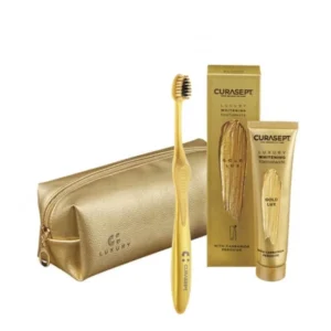 CURASEPT Luxury GOLD zestaw wybielająca pasta do mycia zębów 75 ml + szczoteczka, kosmetyczka